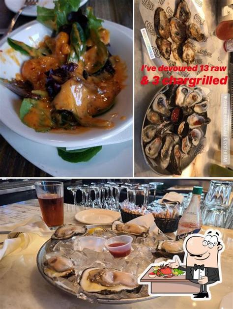 Specialties Located on the corner of the French Quarter, Coterie offers authentic Cajun Creole Cuisine specializing in Chargrilled, Raw and Baked Oysters. . Coterie restaurant oyster bar reviews